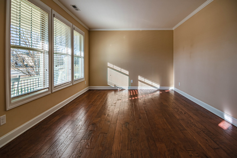 Refinished oak strip flooring in an empty Pennsylvania room before furniture