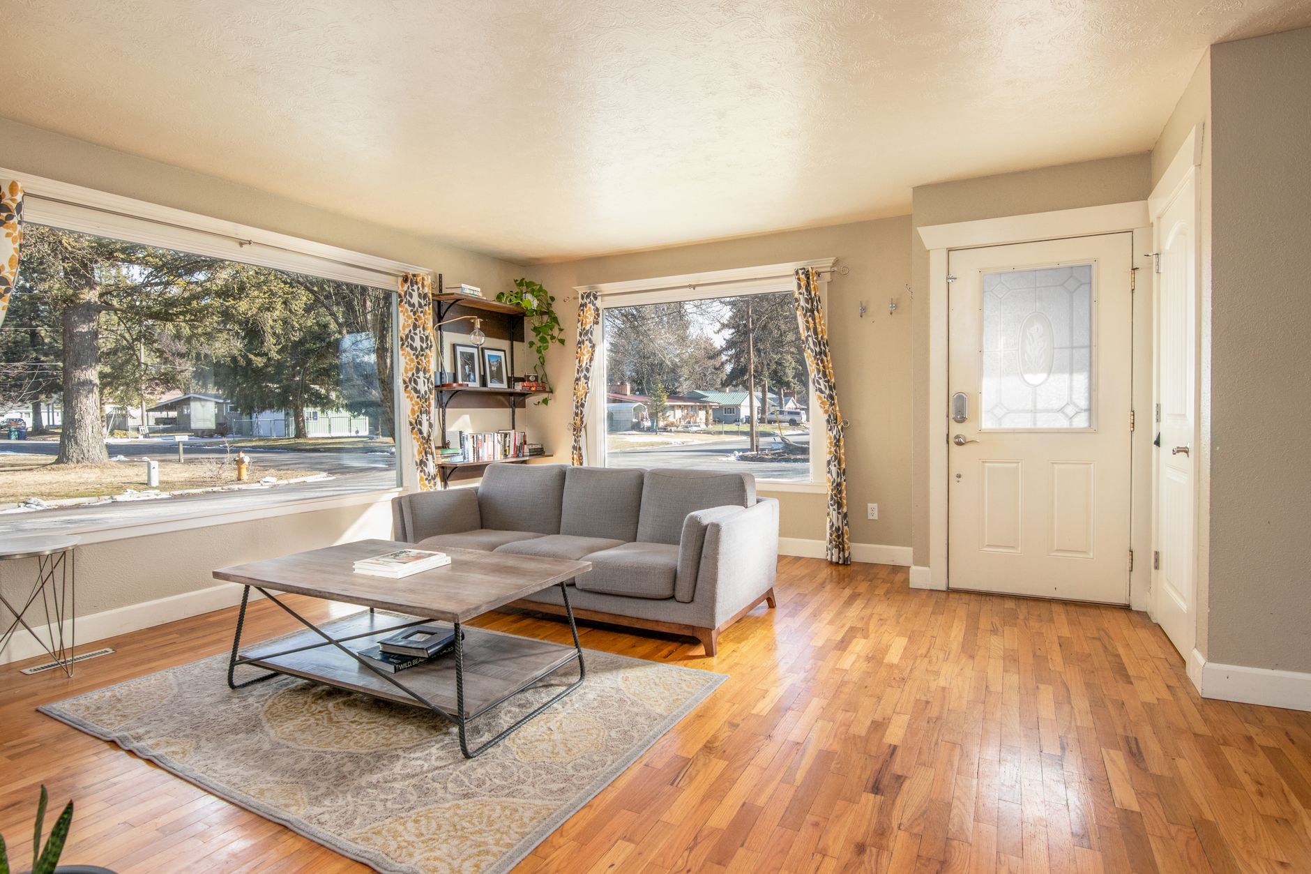 Warm oak hardwood flooring in a sunlit Pennsylvania living room