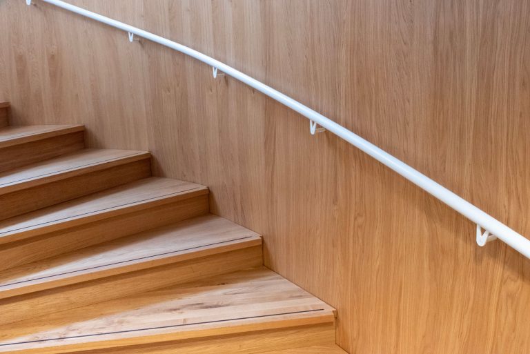 Hardwood stair treads, risers and railing in a residential staircase