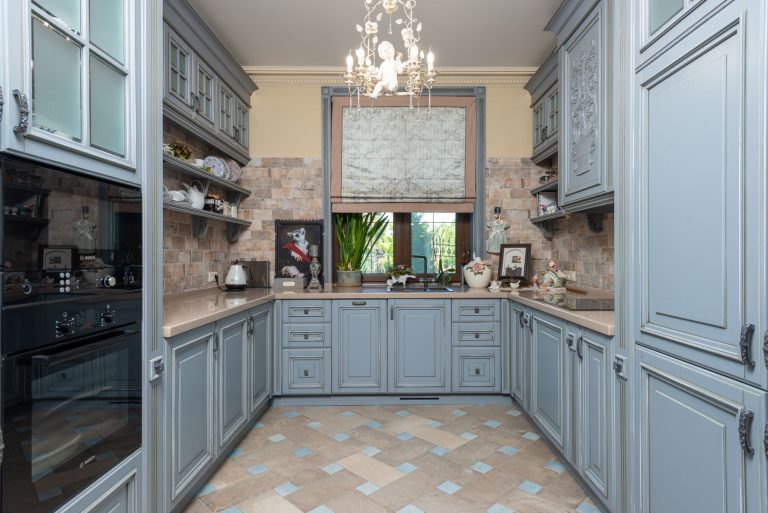 Porcelain tile flooring in a residential kitchen with cabinetry